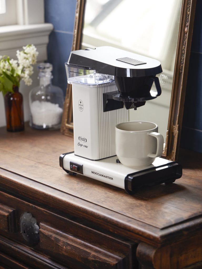 Technivorm Moccamaster One Cup in White over wood furniture