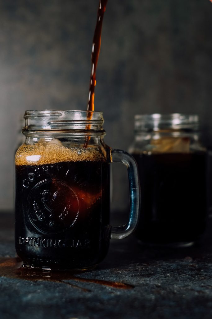 A glass jar with cold brew coffee.
Iced coffee vs cold brew coffee.