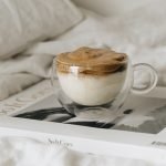 Whipped coffee cup on a book