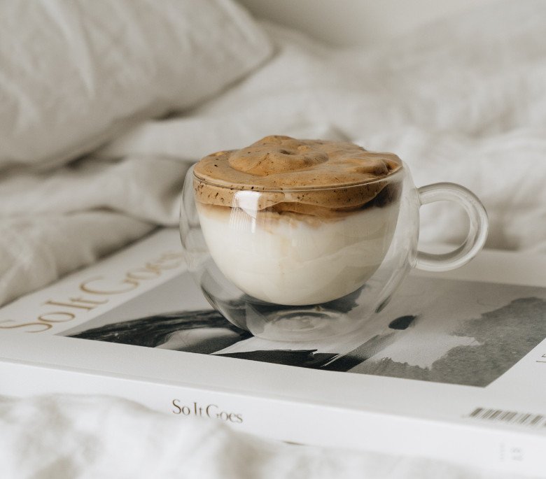 Whipped coffee cup on a book