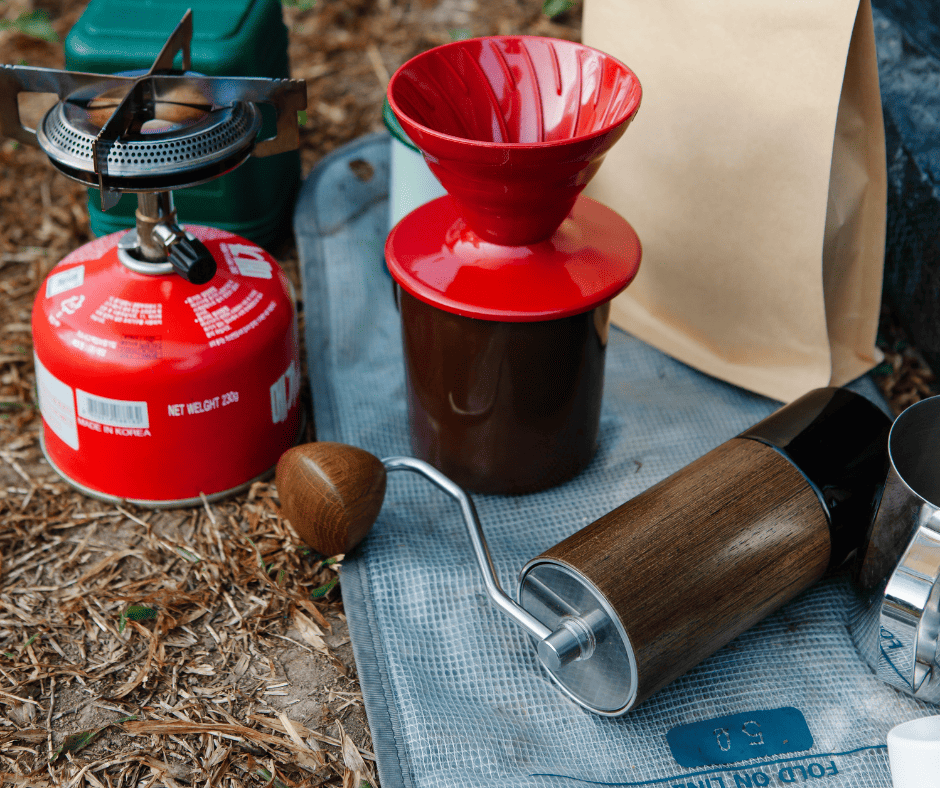 A manual coffee grinder next to a dripper, sitting outdoors.

This is a complementary image for the article about the best coffee grinders for pour-over coffee brewing